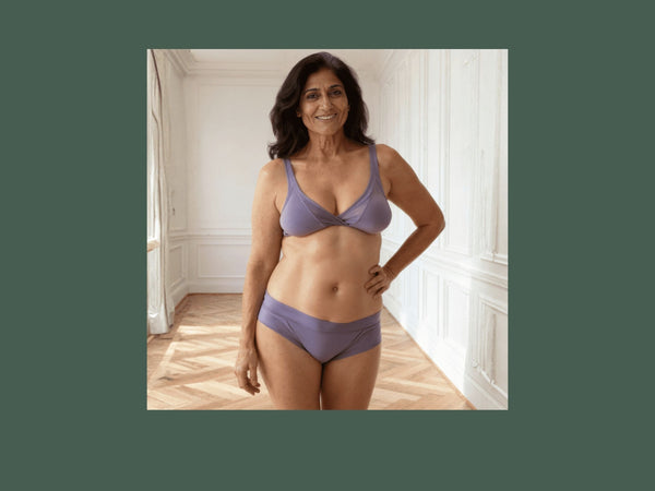 Woman wearing low-rise Engineered brief in periwinkle blue. GOTS certified organic cotton. Absorbs 15mL.
