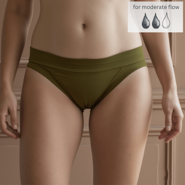 Front detail of woman wearing low-rise Engineered brief in moss. Made from GOTS certified organic cotton. Protection from light bladder leaks and moderate period flow. Absorbs 15mL.