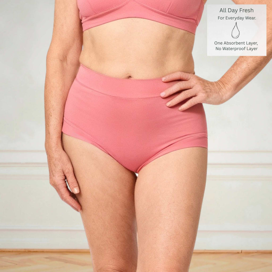Wicks Intimates Anything But Basic Brief II All Day Fresh lightweight absorbent underwear in dusky pink with absorbency badge on model, detail view