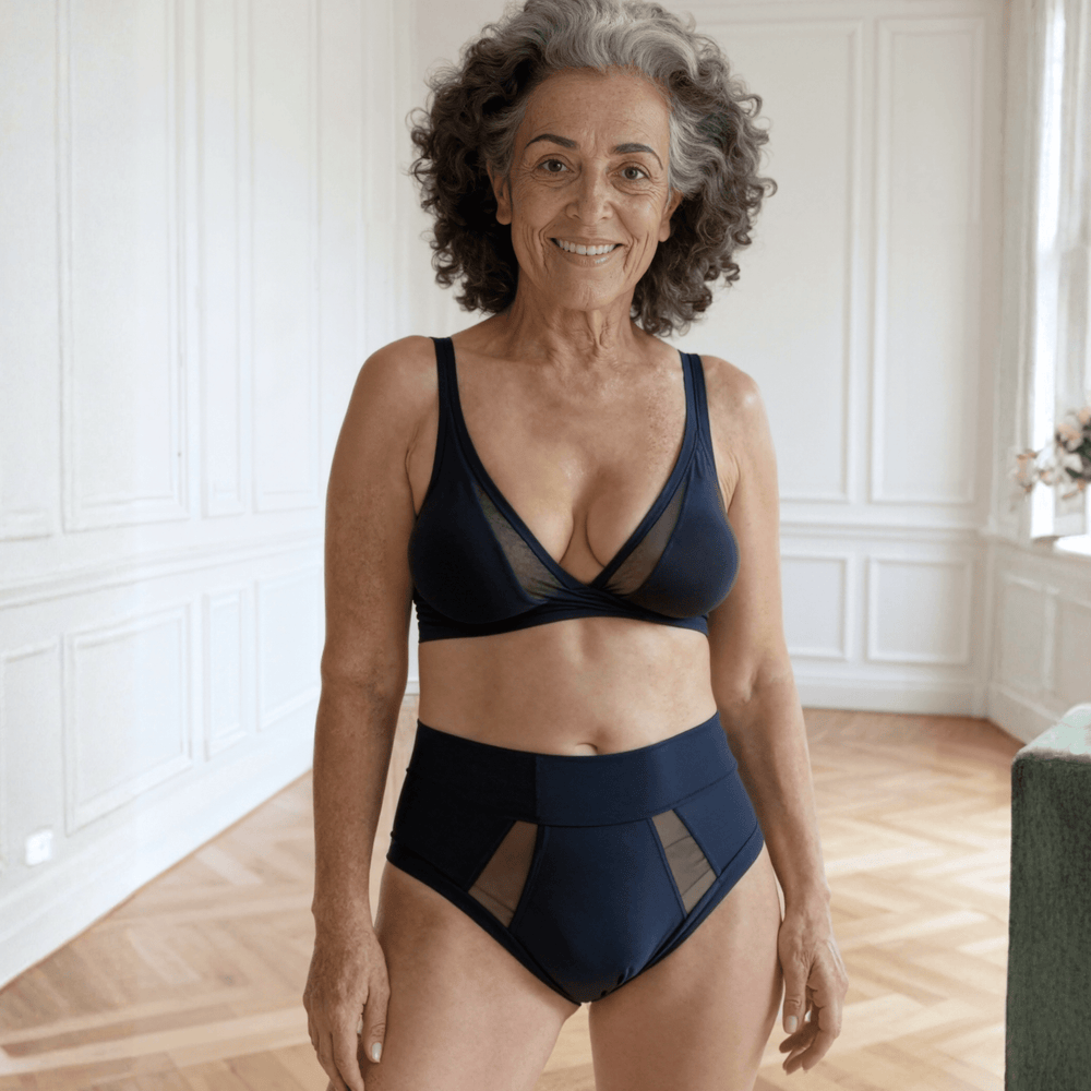 Woman in her 70s is facing the viewer wearing the size Medium Emanate brief in Slate Navy made from OEKO TEX certified fabric