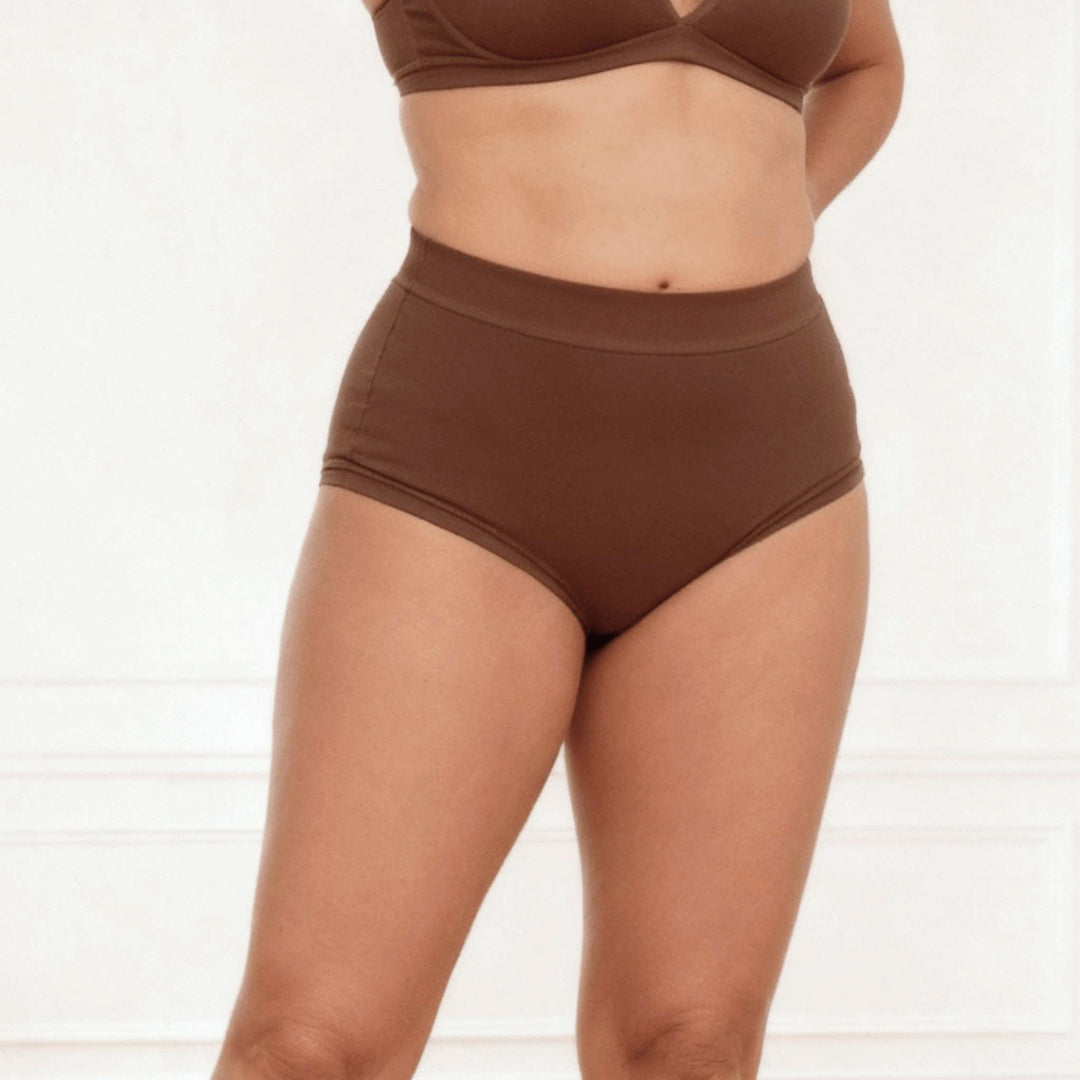 Dark chocolate Anything But Basic II 15mL absorbent brief front view on model by Wicks Intimates