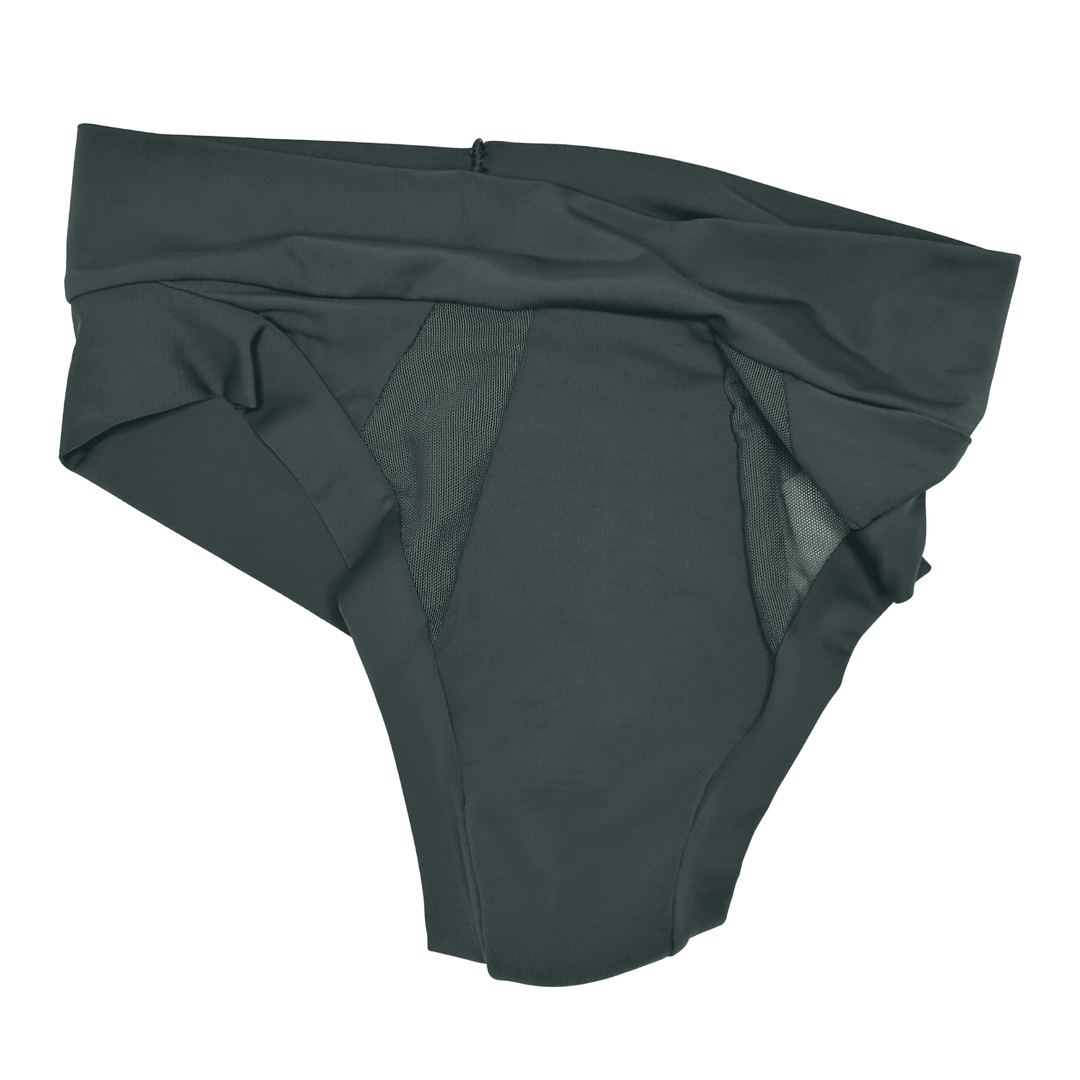 Artfully strewn flat lay image of the Striation Thong in Forest green made from OEKO TEX certified fabric