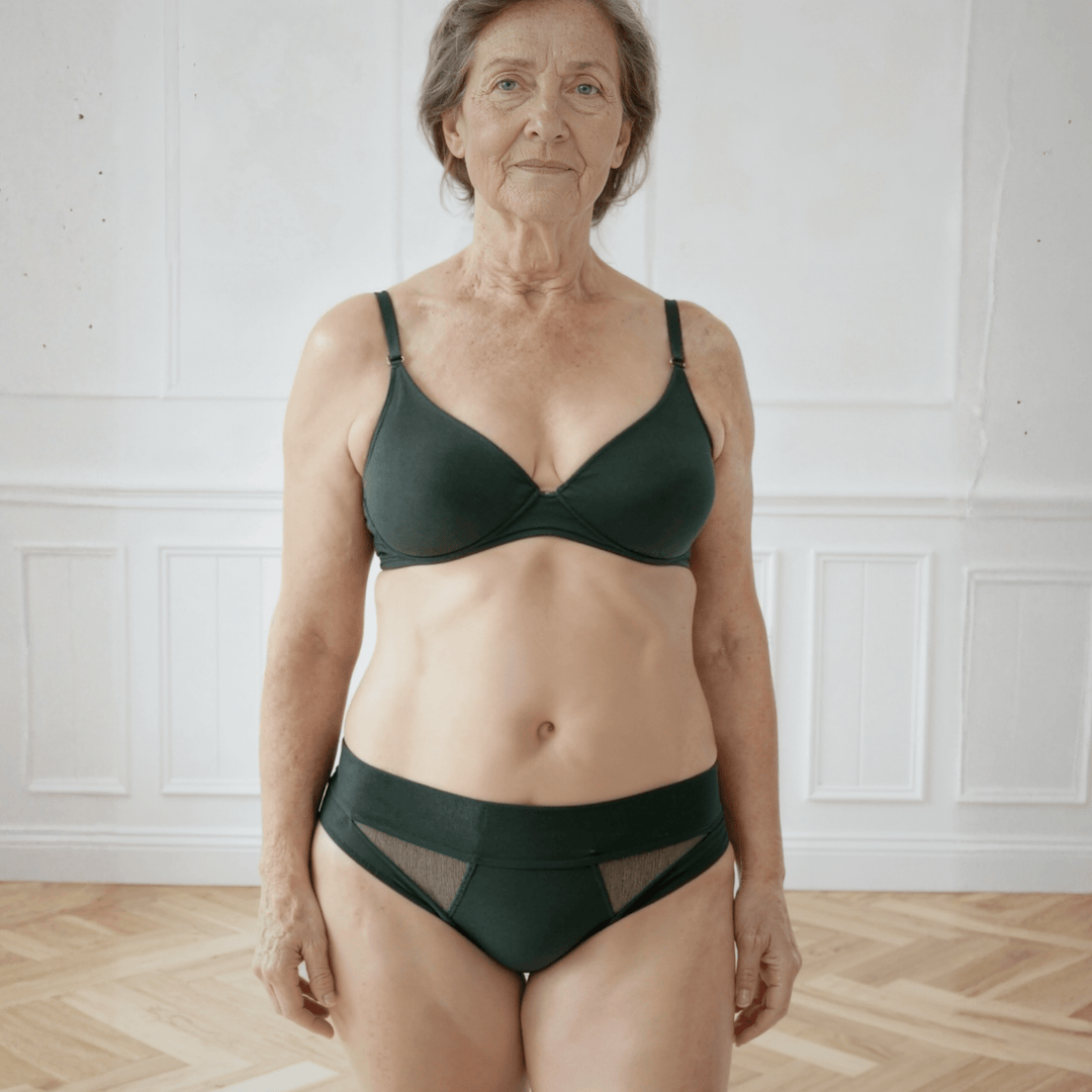 Woman in her 60s wearing the low-rise Swept Away brief in forest green made from OEKO TEX certified fabric