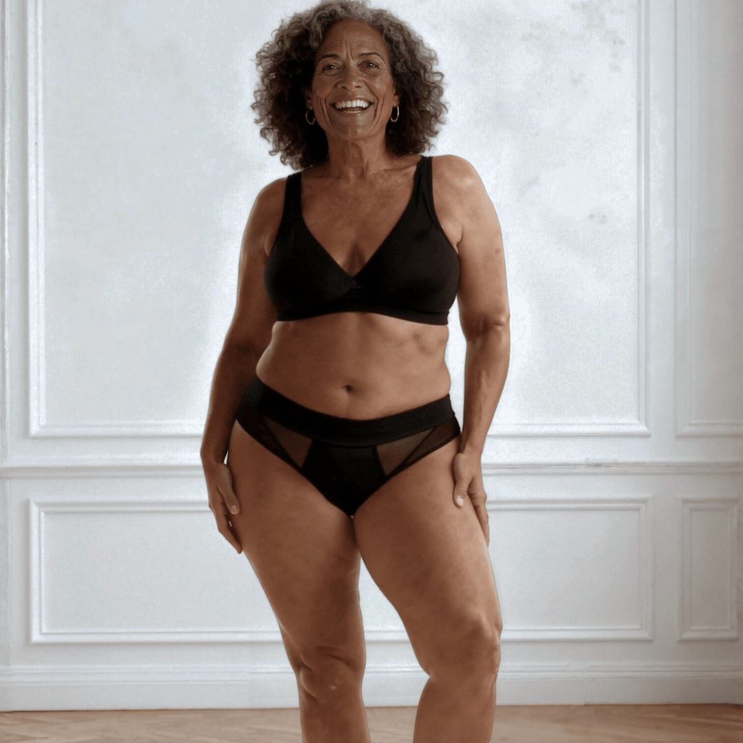 Woman in her 50s wearing the low-rise Swept Away brief in Obsidian Black made from OEKO TEX certified fabric