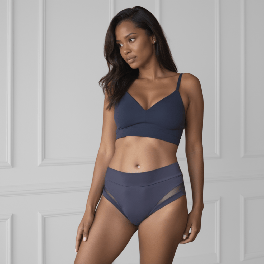 A woman in her 30s is facing forwards wearing a size S Valley brief in Slate Navy made from OEKO TEX certified fabric