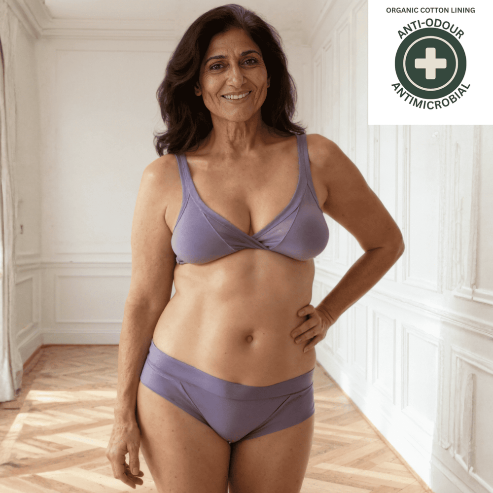 Woman wearing the Engineered brief in periwinkle with antimicrobial and anti-odour badge top right.