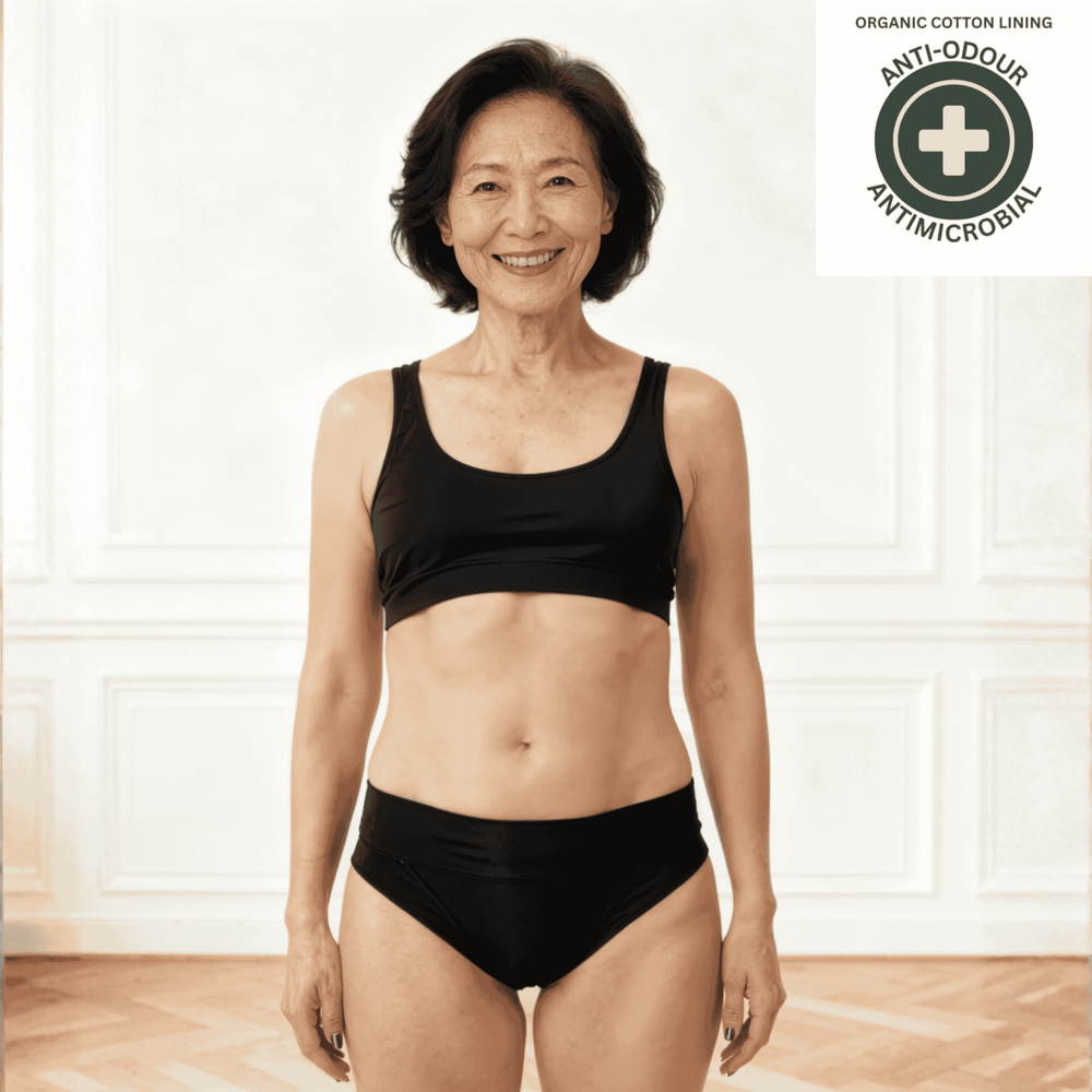 Woman wearing the Elevated Essentials brief in black with antimicrobial and anti-odour badge top right.